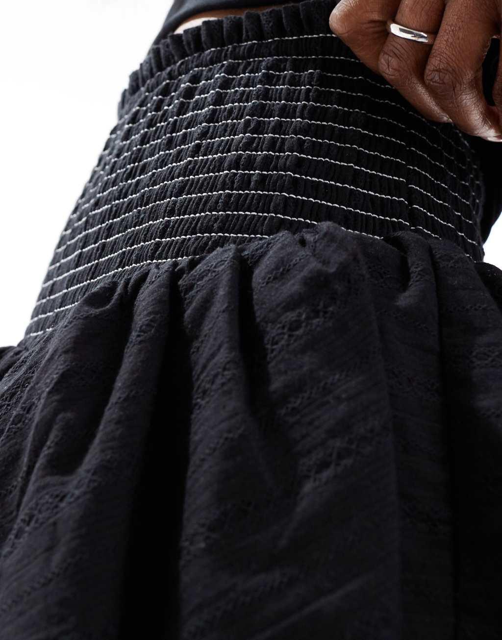 Urban Revivo shirred waist detail tiered ruffle rara mini skirt in black Product Image