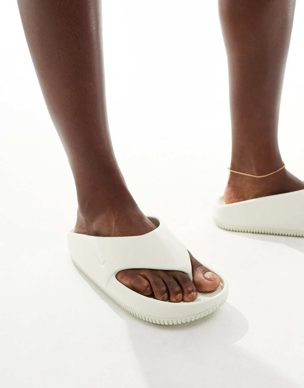 Nike Calm flip flops in off white  Product Image