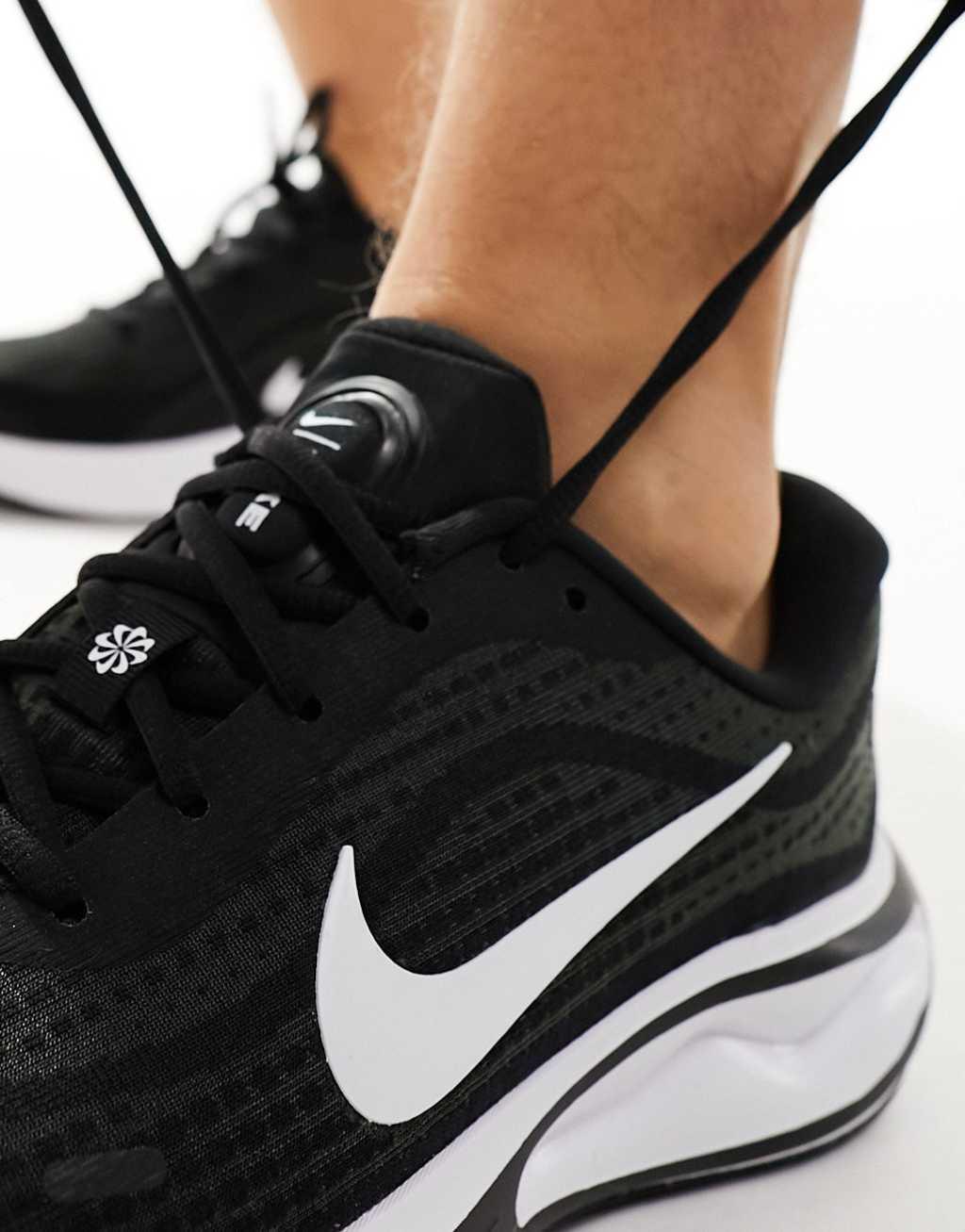 Nike Running Journey Run sneakers in black and white Product Image