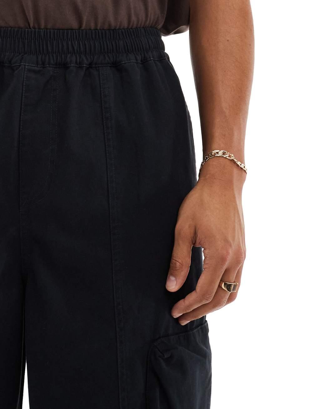 ASOS DESIGN super baggy cargo pants with panel details in black Product Image