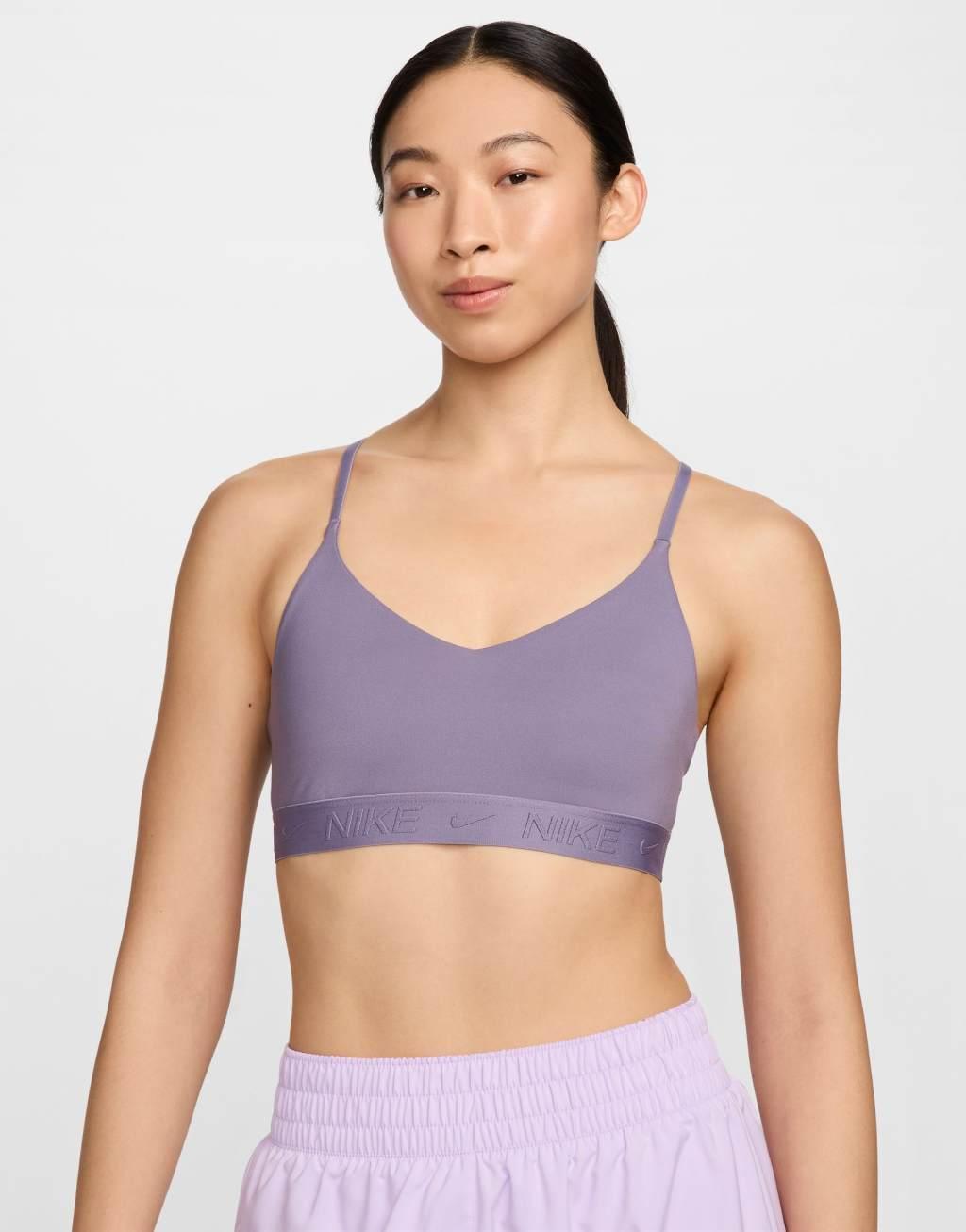 Nike Training Indy Dri-FIT light support sports bra in purple  Product Image