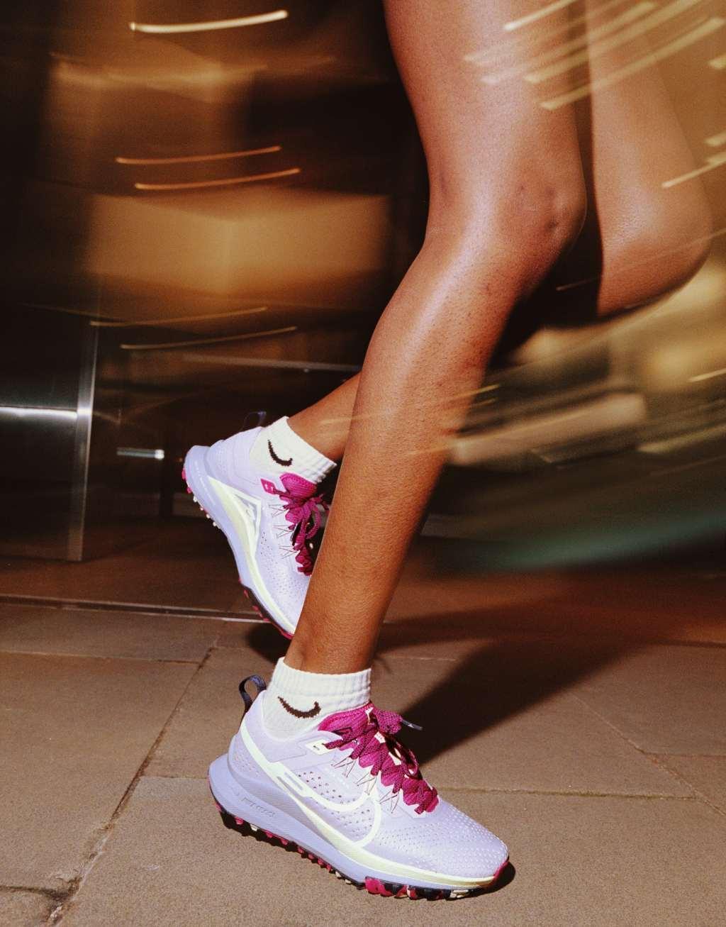 Nike Running React Pegasus Trail 4 sneakers in off white and fierce pink Product Image