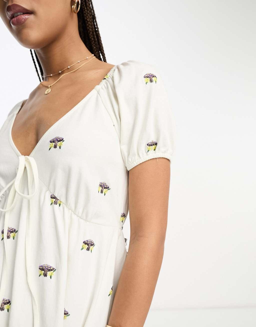 ASOS DESIGN embroidered v neck mini dress with mushroom embroidery in ecru Product Image