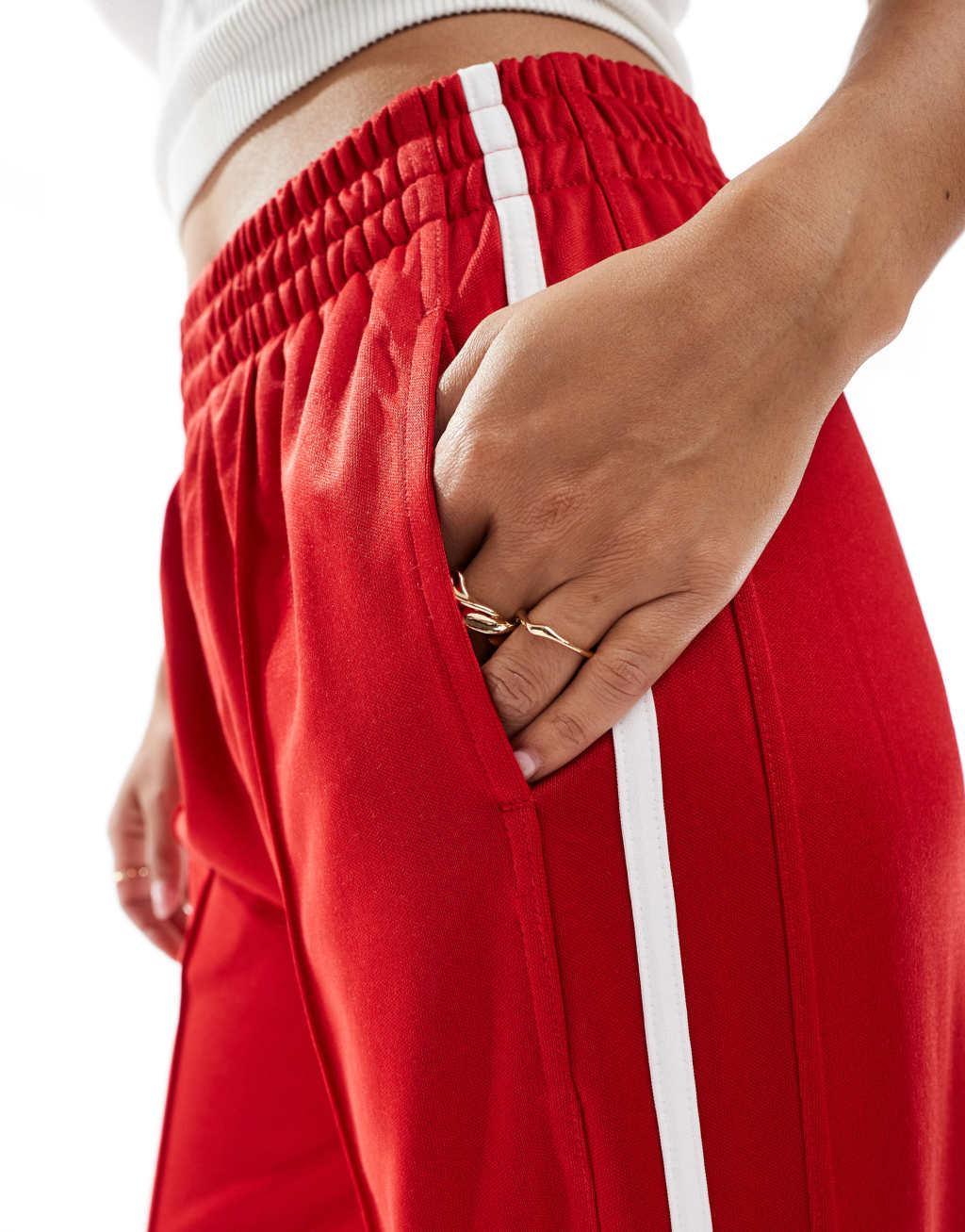 Bershka wide leg piping detail sweatpants in red Product Image