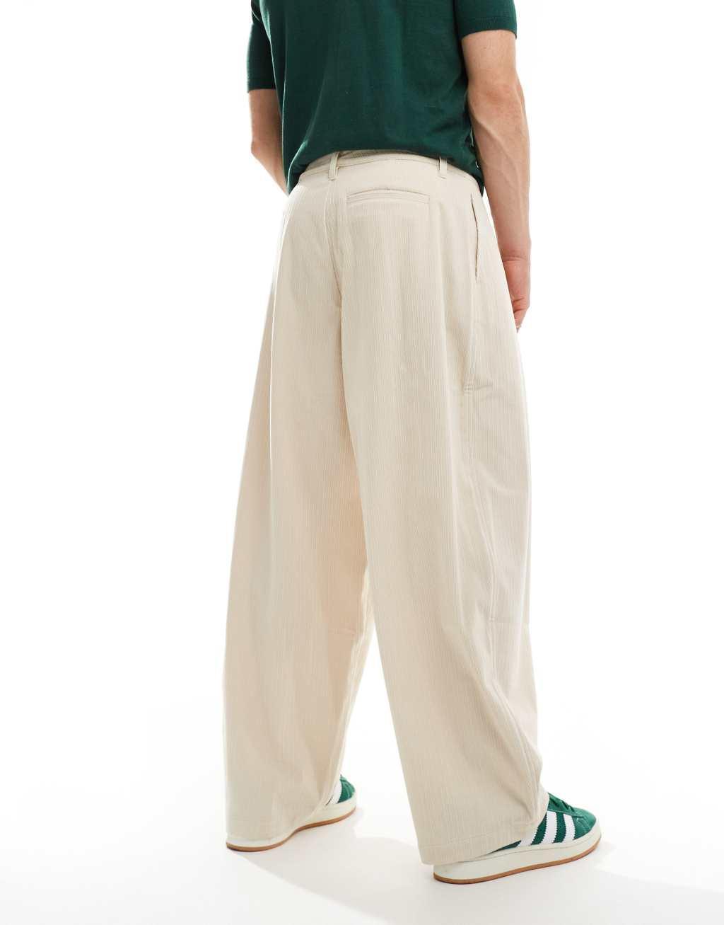 ASOS DESIGN oversized balloon corduroy pants with pleats in cream Product Image