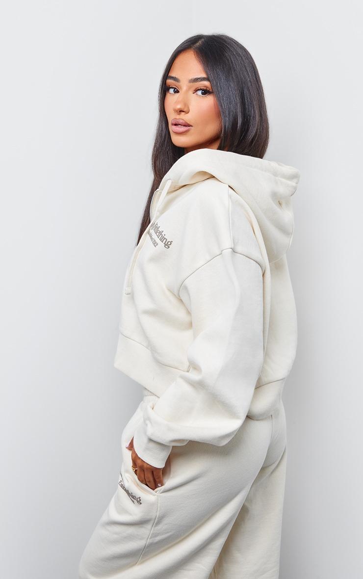 PRETTYLITTLETHING Petite Cream Premium Print Zip Front Hoodie Product Image