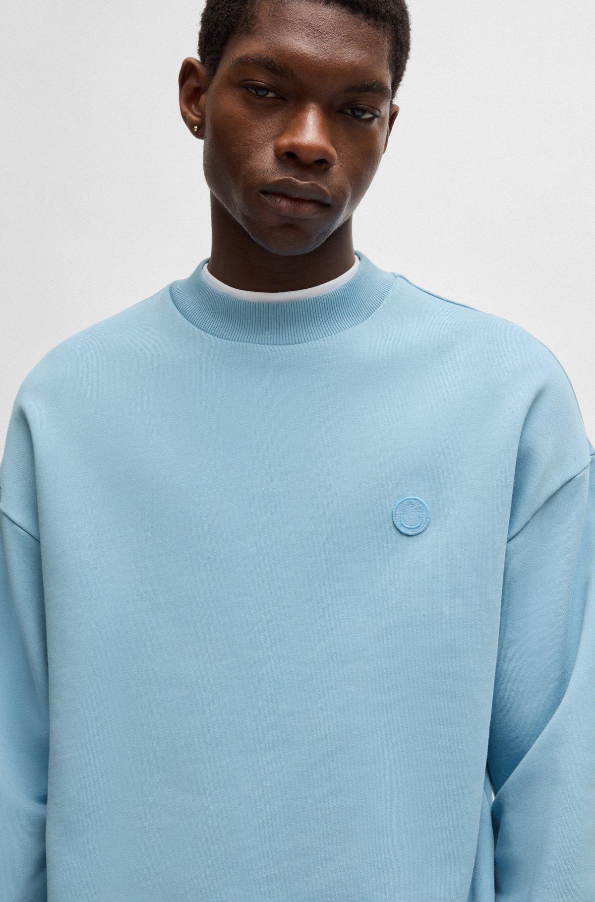 Cotton-terry sweatshirt with Happy HUGO logo patch Product Image