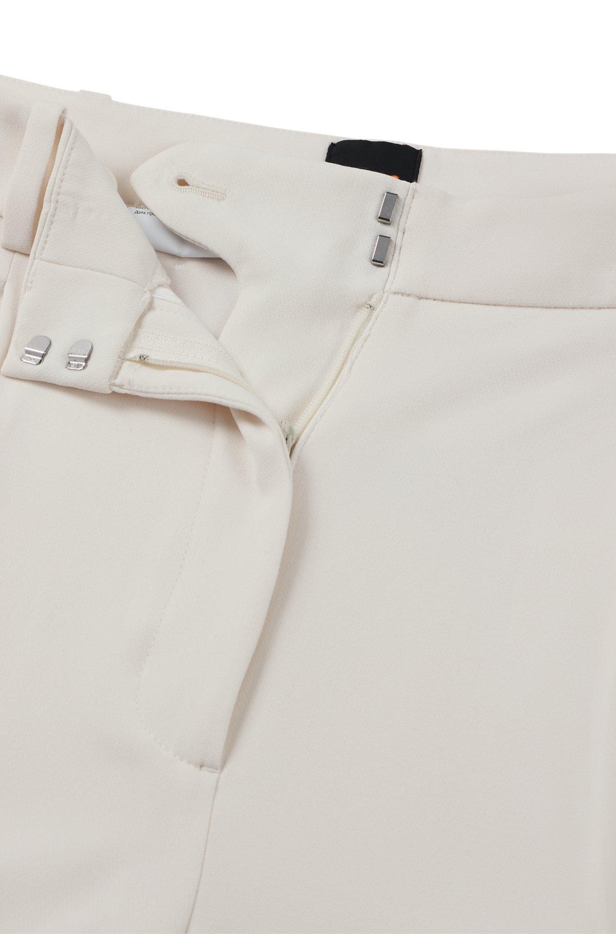 Boot-leg trousers in stretch fabric Product Image