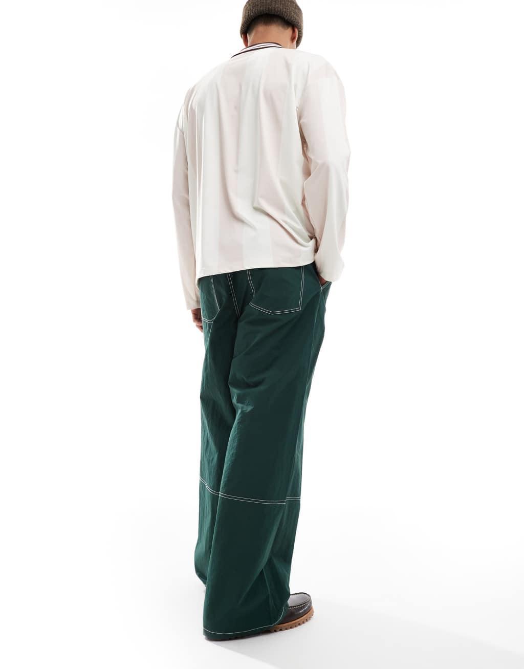 ASOS DESIGN super baggy pant in green nylon with contrast stitch Product Image