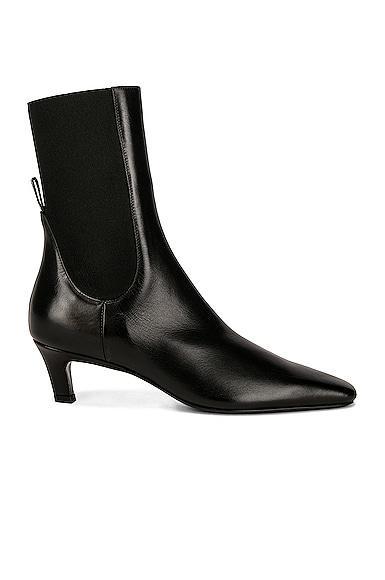 Toteme The Mid Heel Boot in Black - Black. Size 37 (also in 35). Product Image