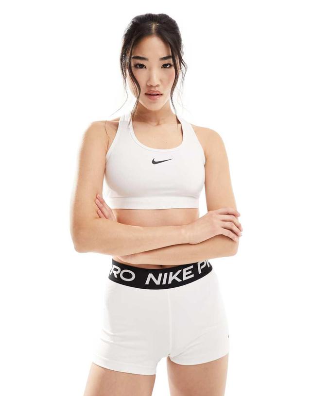 Nike Training swoosh medium support sports bra in white Product Image