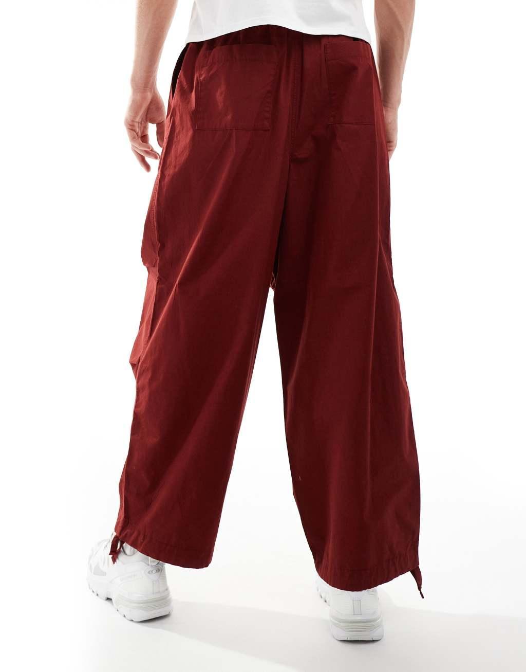 ASOS DESIGN baggy balloon parachute pant in burgundy Product Image