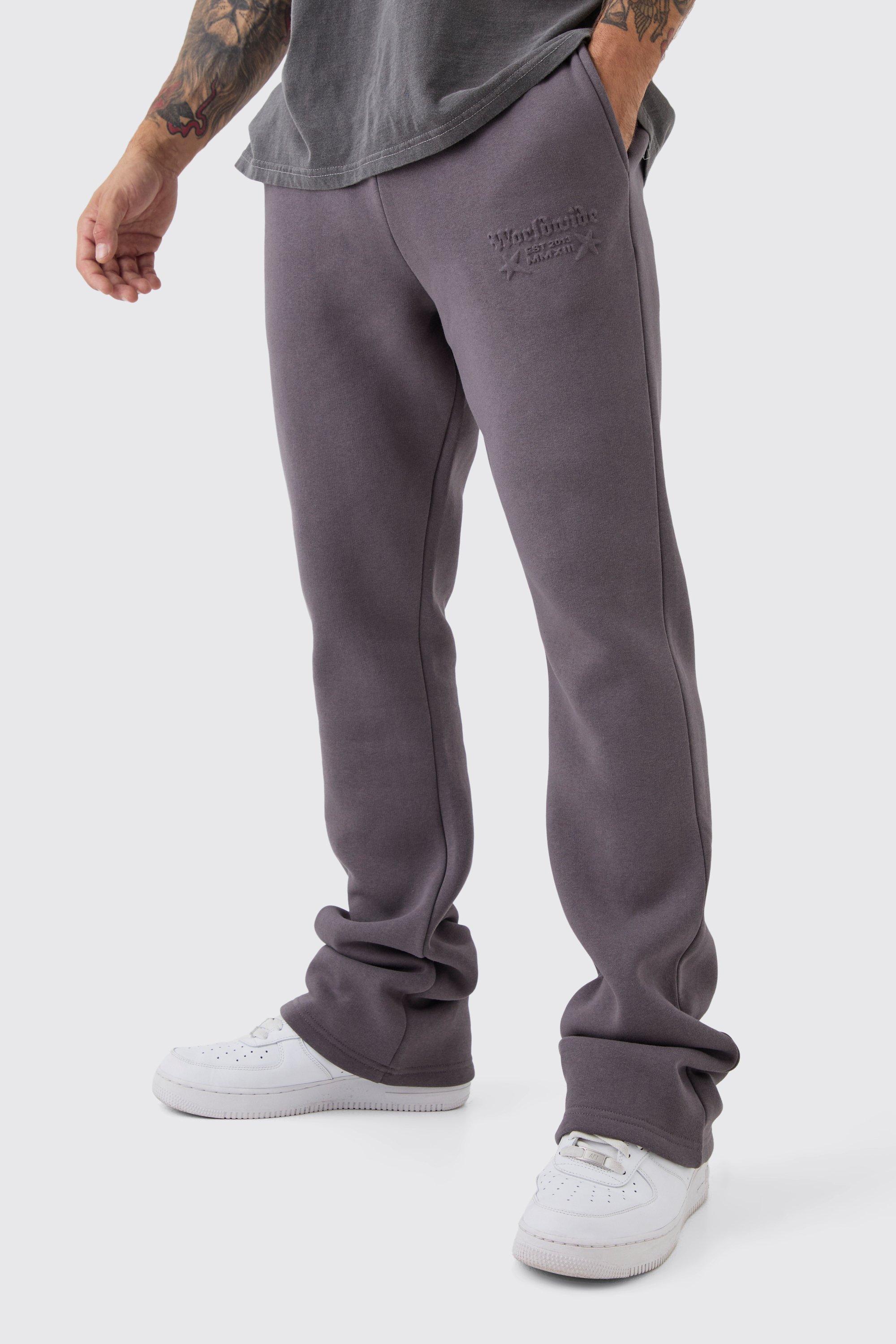 Slim Stacked Worldwide Emboss Sweatpants | boohooMAN USA Product Image