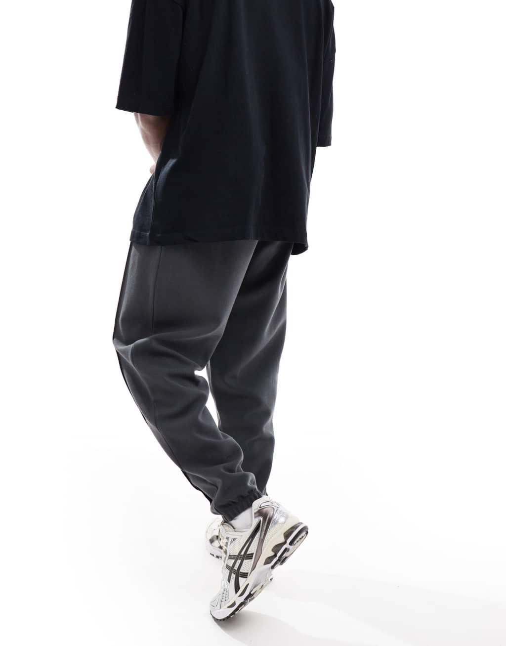 ASOS DESIGN oversized twill jersey sweatpants with pintucks in washed black Product Image