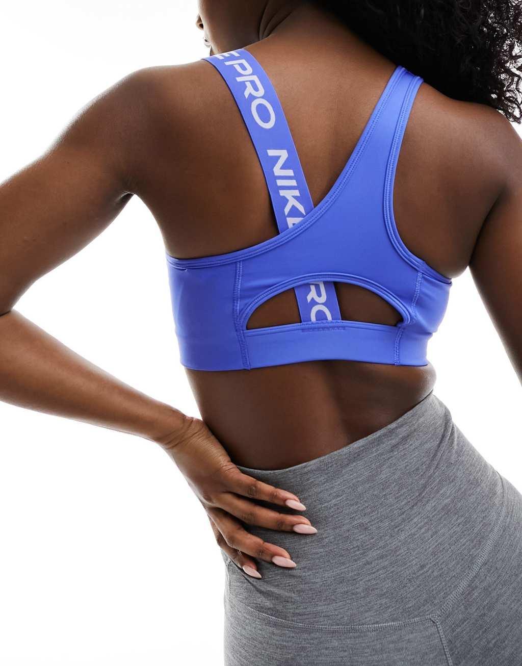 Nike Pro Training swoosh asymmetric sports bra in blue Product Image