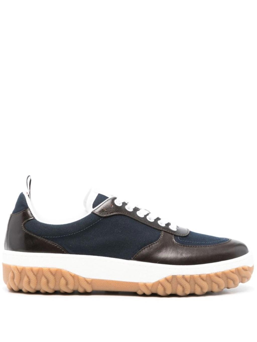 Letterman Panelled Sneakers In Navy Blue Product Image