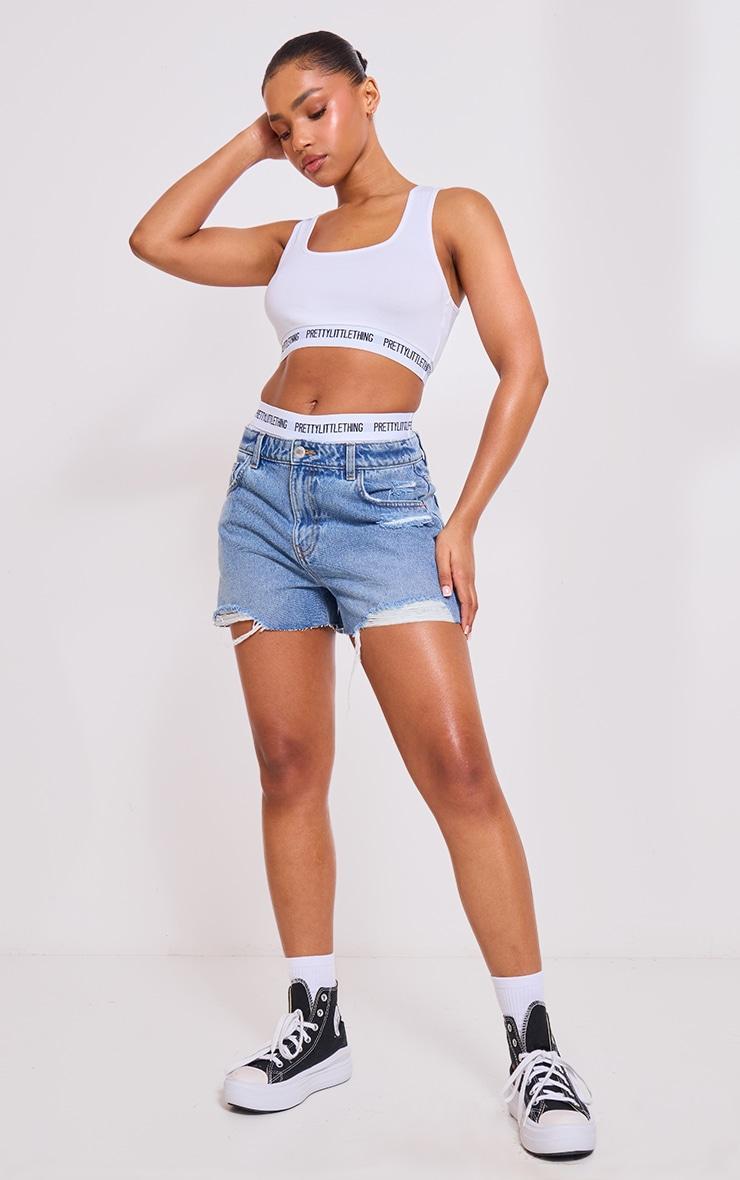 PRETTYLITTLETHING Mid Blue Wash Distressed High Rise Mom Denim Shorts Product Image