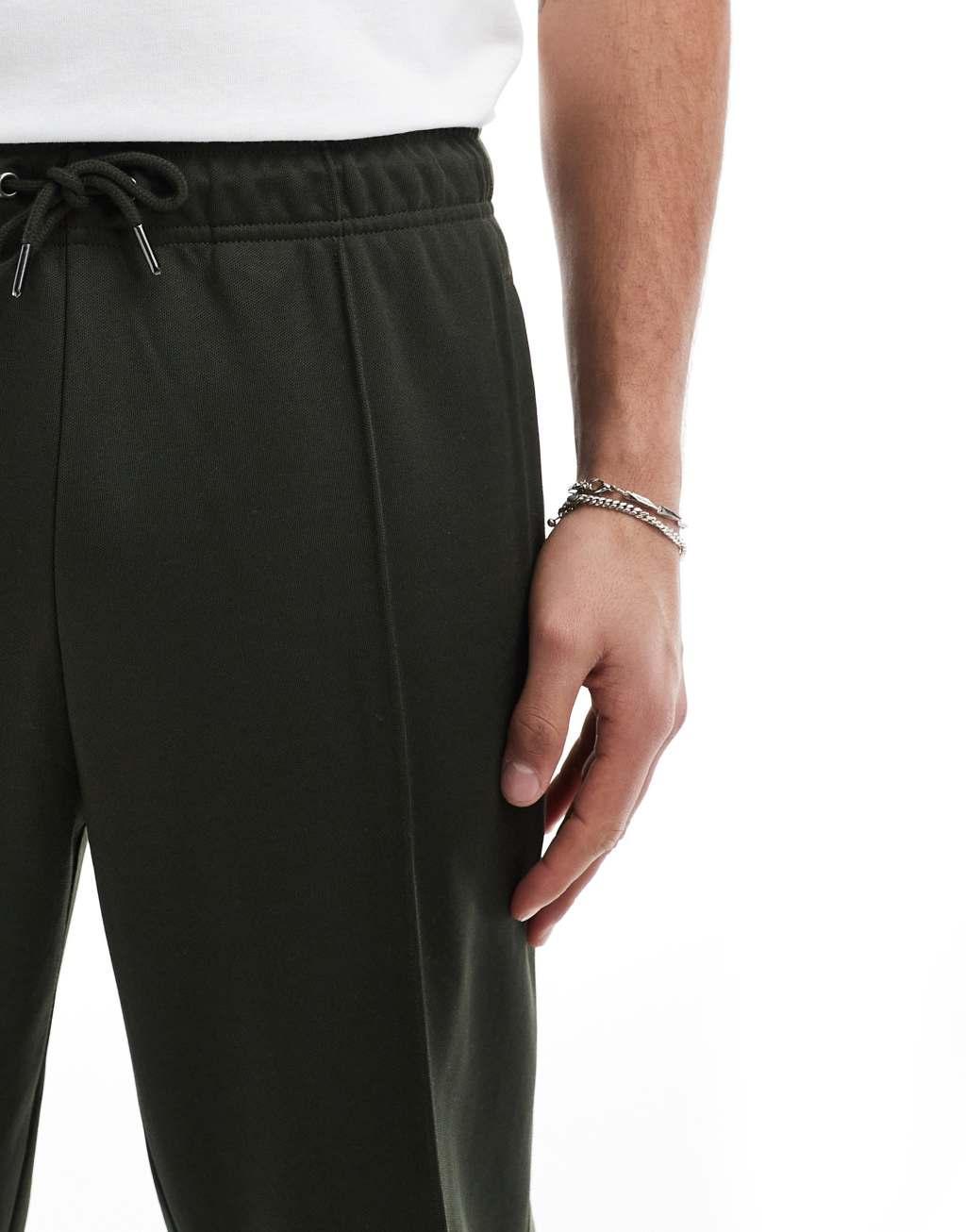 Fred Perry track sweatpants in dark green with taping - part of a set Product Image