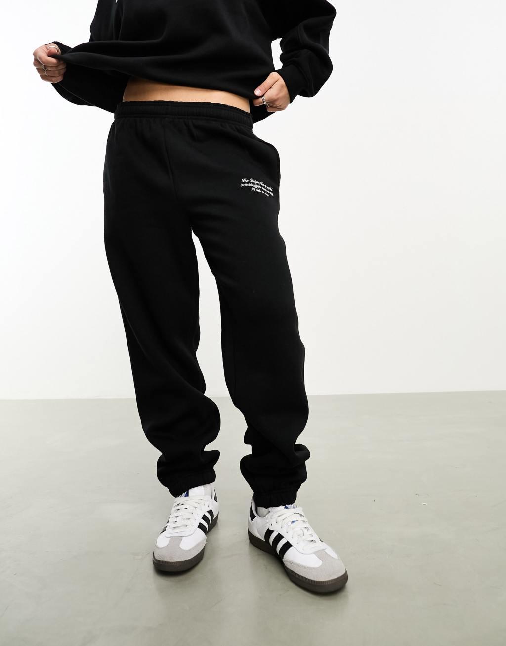 The Couture Club applique sweatpants in black Product Image