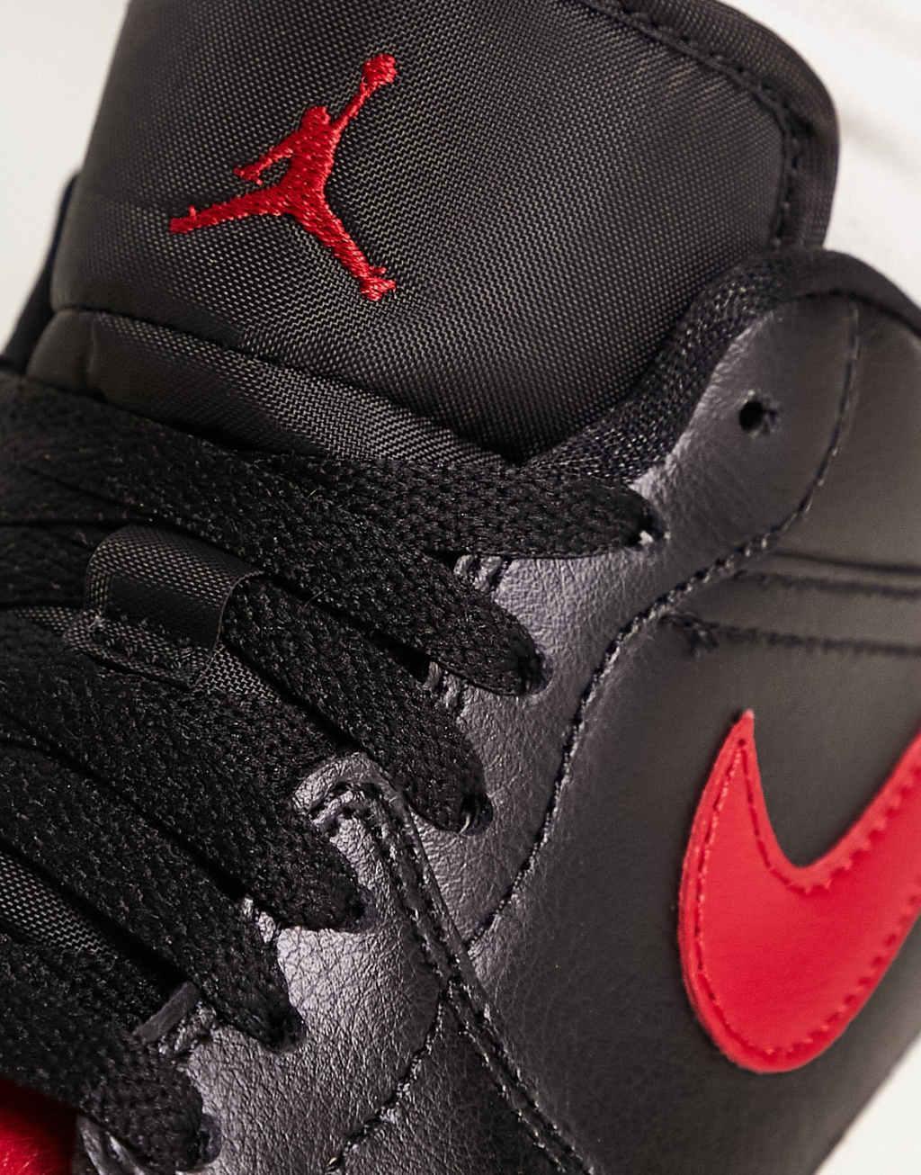 Nike Jordan Air 1 Low sneakers in black and red Product Image