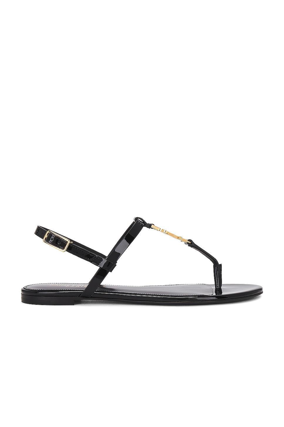 Saint Laurent Cassandra Flat Sandal in Noir - Black. Size 36.5 (also in 37, 38, 40.5). Product Image