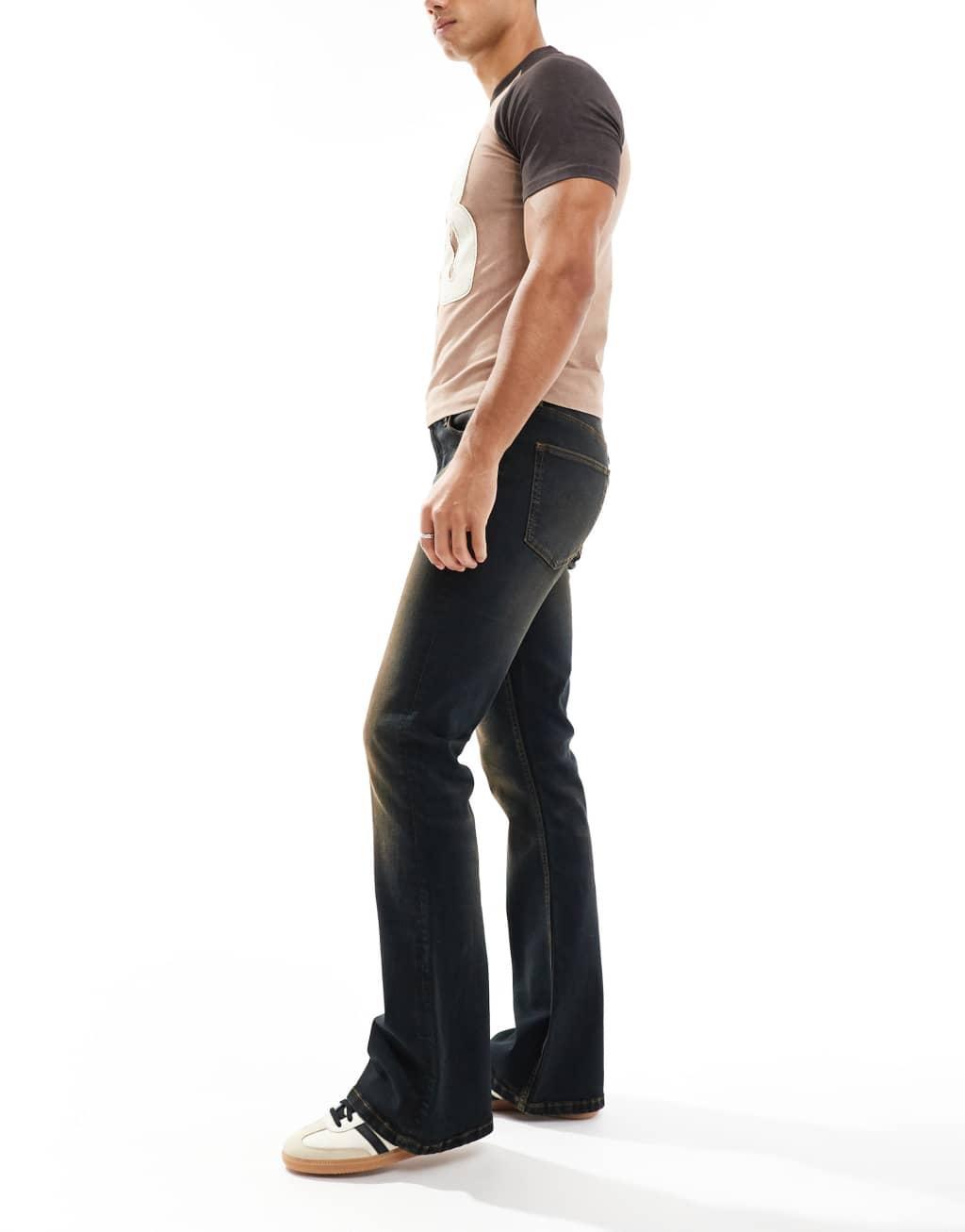 ASOS DESIGN stretch flare jeans in black with brown tint Product Image