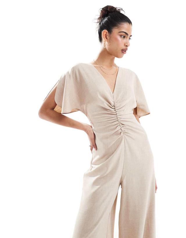 ASOS DESIGN ruched front cut out back jumpsuit in beige Product Image