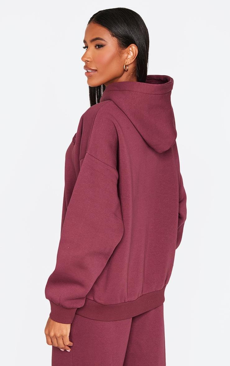 PRETTYLITTLETHING Burgundy Athletics Club Embossed Graphic Oversized Hoodie Product Image