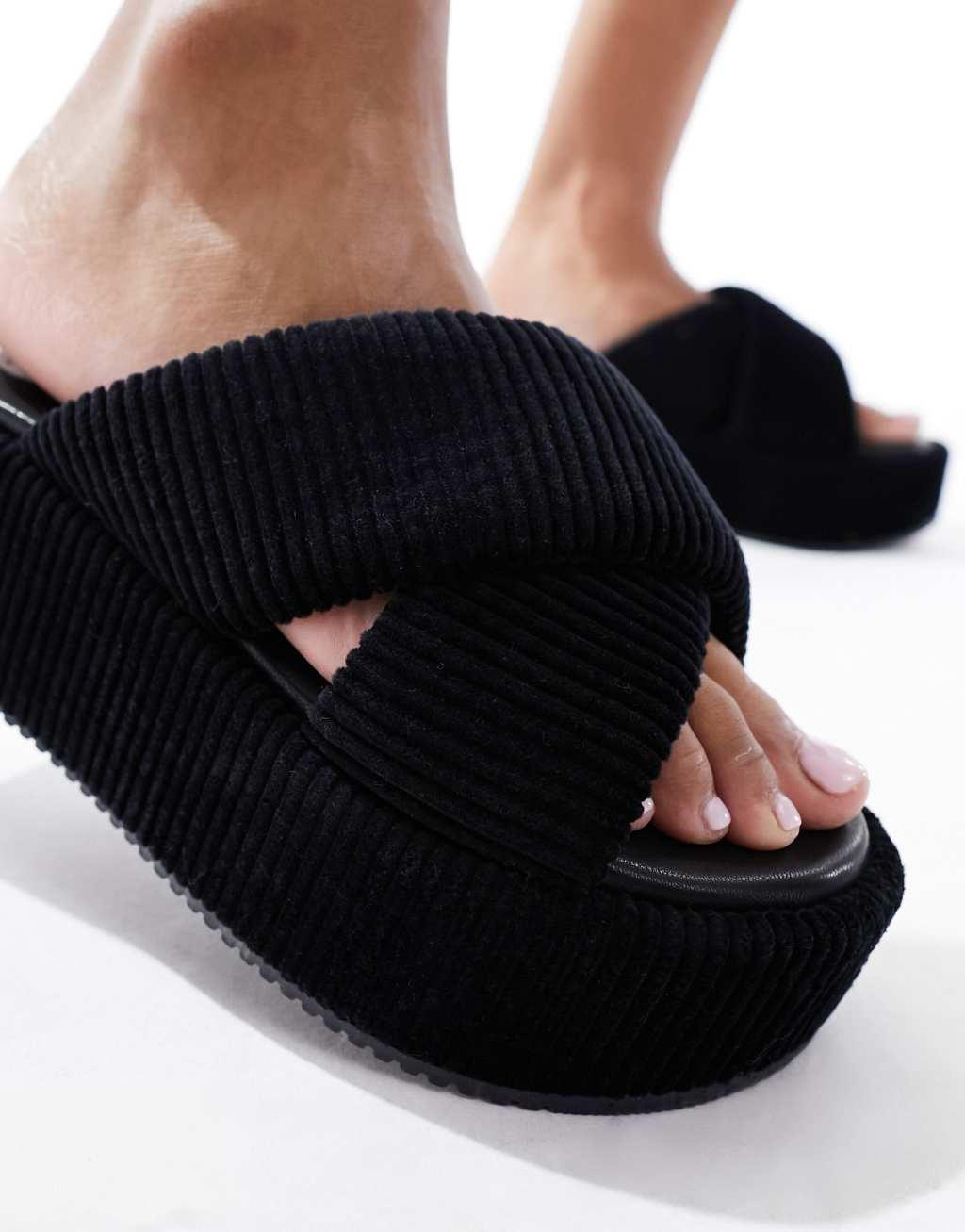 ASOS DESIGN Thunder padded cross strap flatform sandals in black Product Image