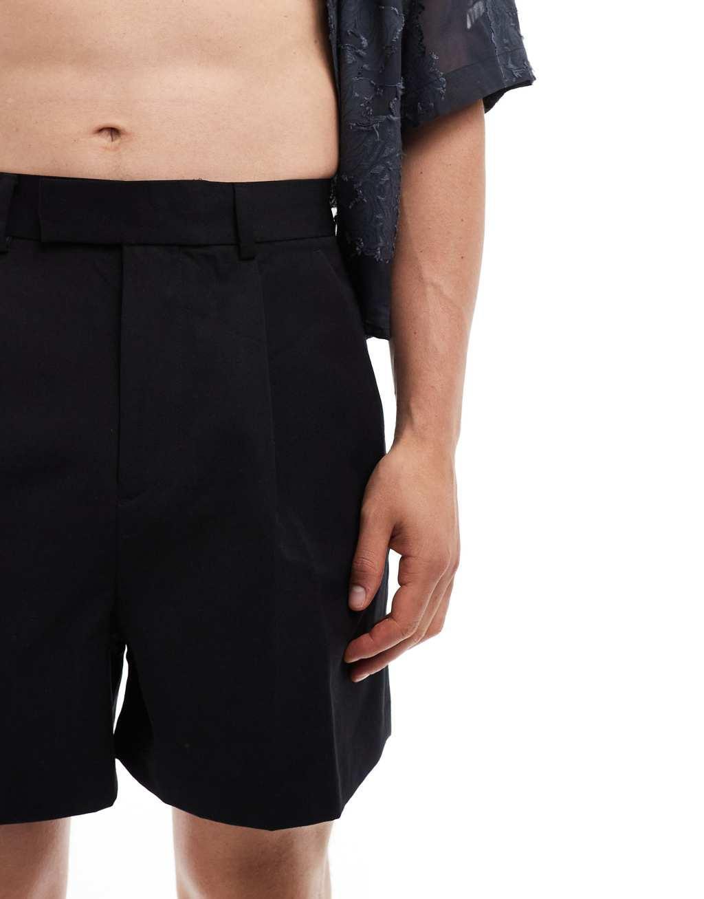 ASOS DESIGN smart cropped bermuda shorts in black Product Image