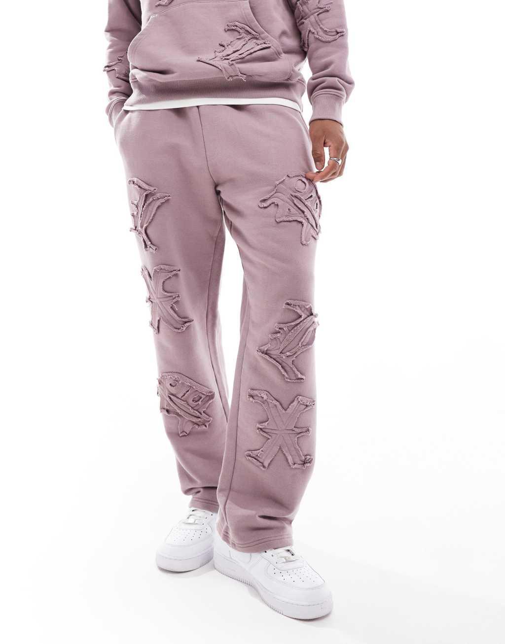 Liquor N Poker allover motif straight leg sweatpants in berry mix - part of a set Product Image