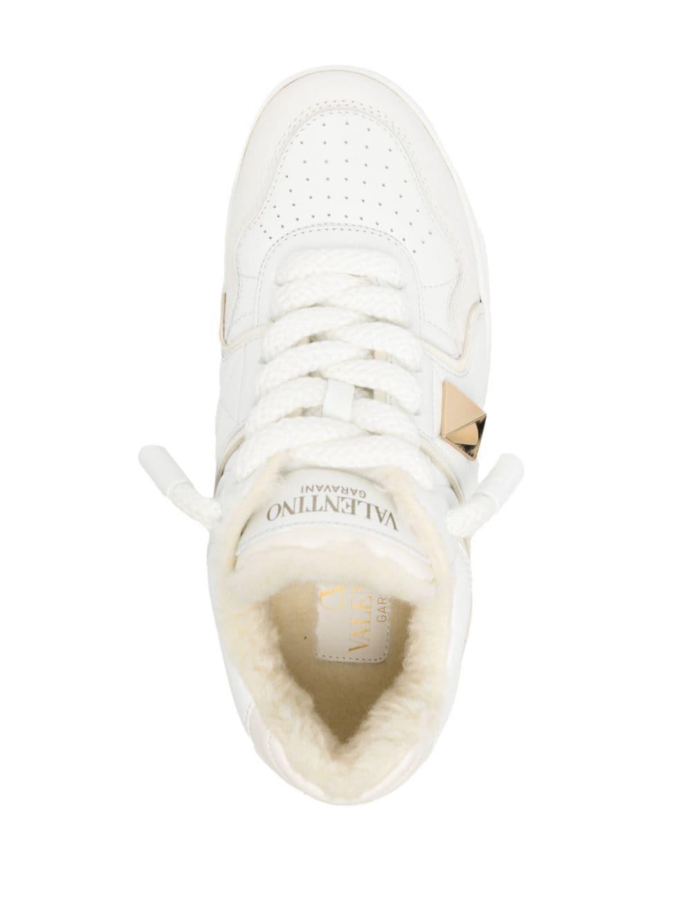 Roman Stud Leather Sneaker In White Product Image