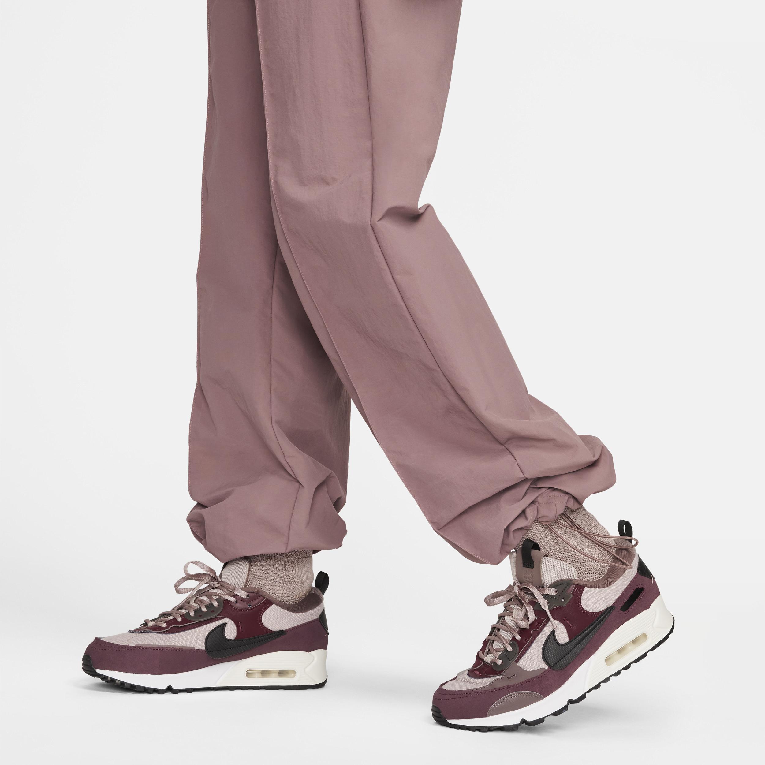 Nike Trend woven baggy parachute pants in smokey mauve Product Image