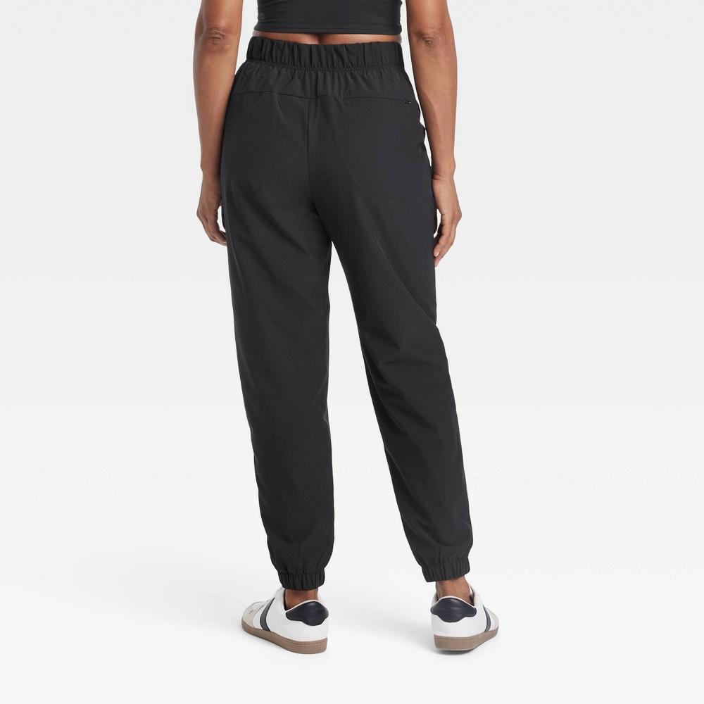 Women's High-Rise Winter Woven Lined Joggers - All In Motion™ Black M Product Image