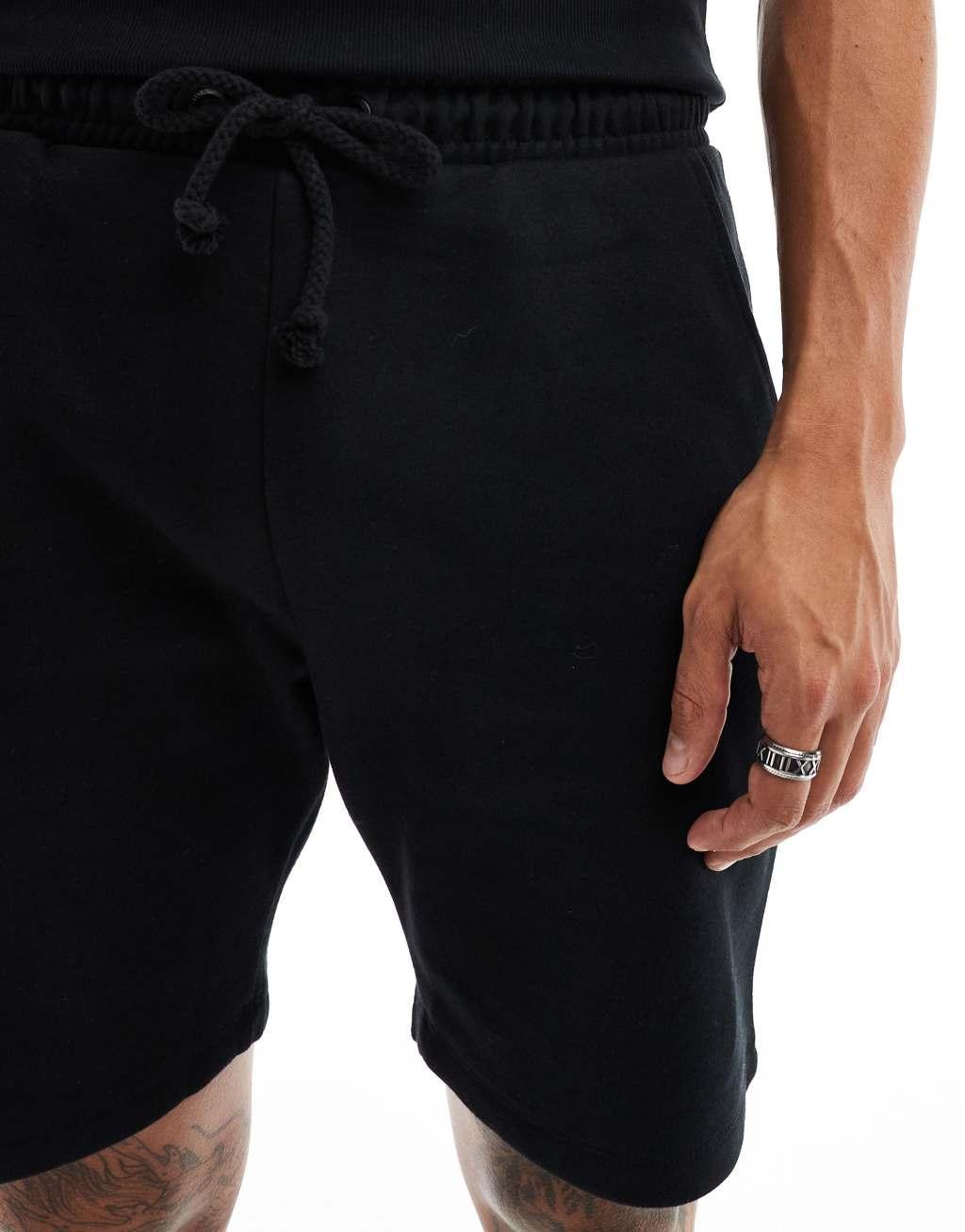 COLLUSION jersey shorts in black Product Image