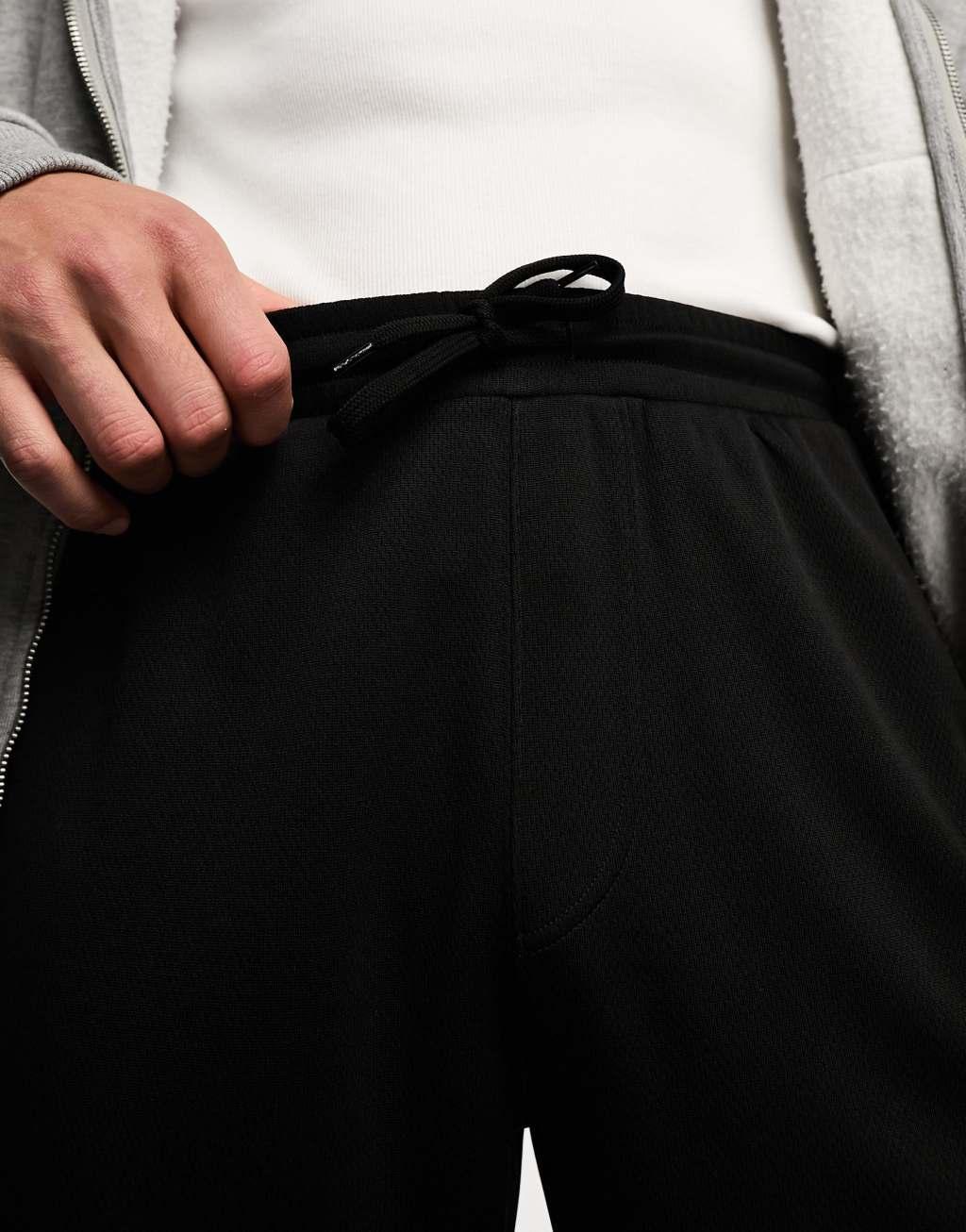 Weekday Hank tracksuit pants in black Product Image