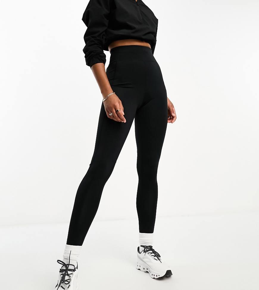 ASOS 4505 CurveIcon running tie waist gym leggings with phone pocket in navy Product Image