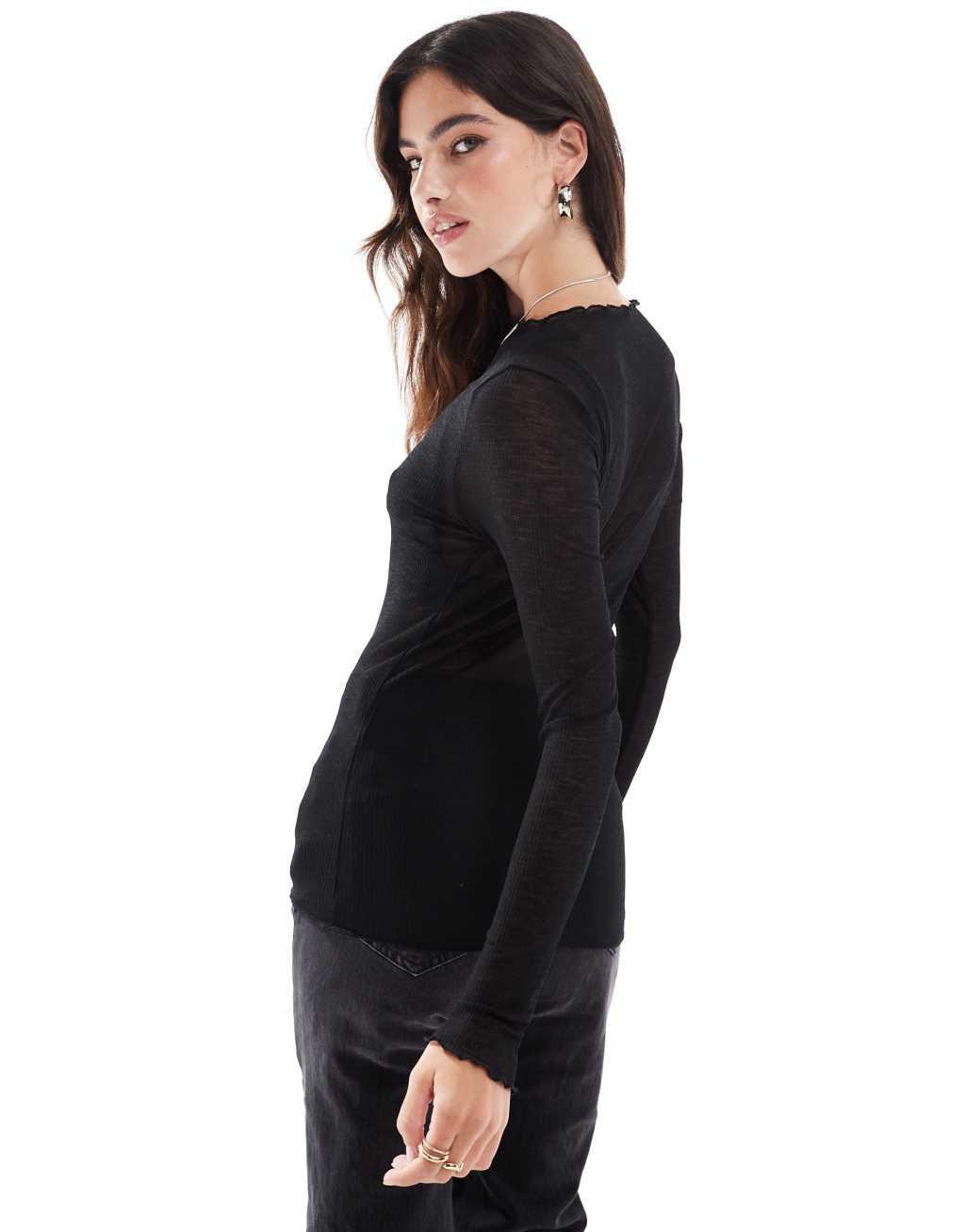 Vero Moda fine jersey long sleeve lettuce edge top in black Product Image