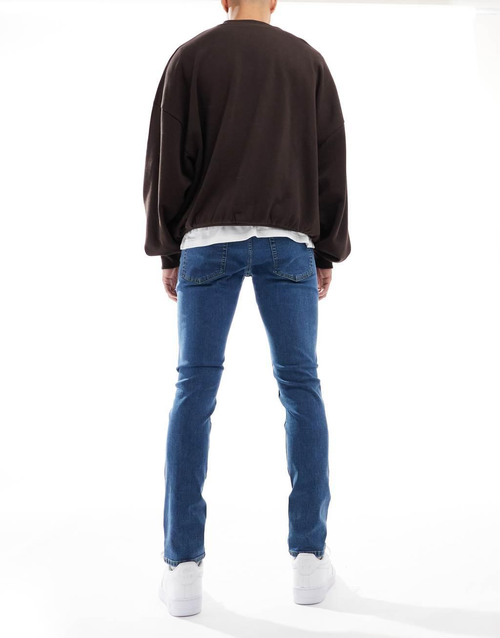 JJ Rebel luke slim fit jeans in mid blue wash  Product Image