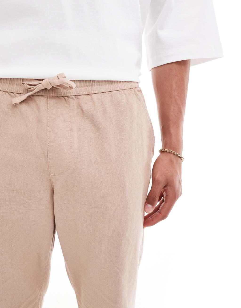 ASOS DESIGN tapered linen pants in brown with elastic waist Product Image