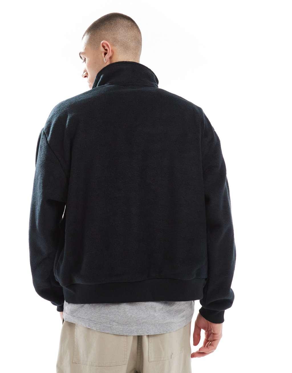 ASOS DESIGN cropped fleece track jacket in black Product Image