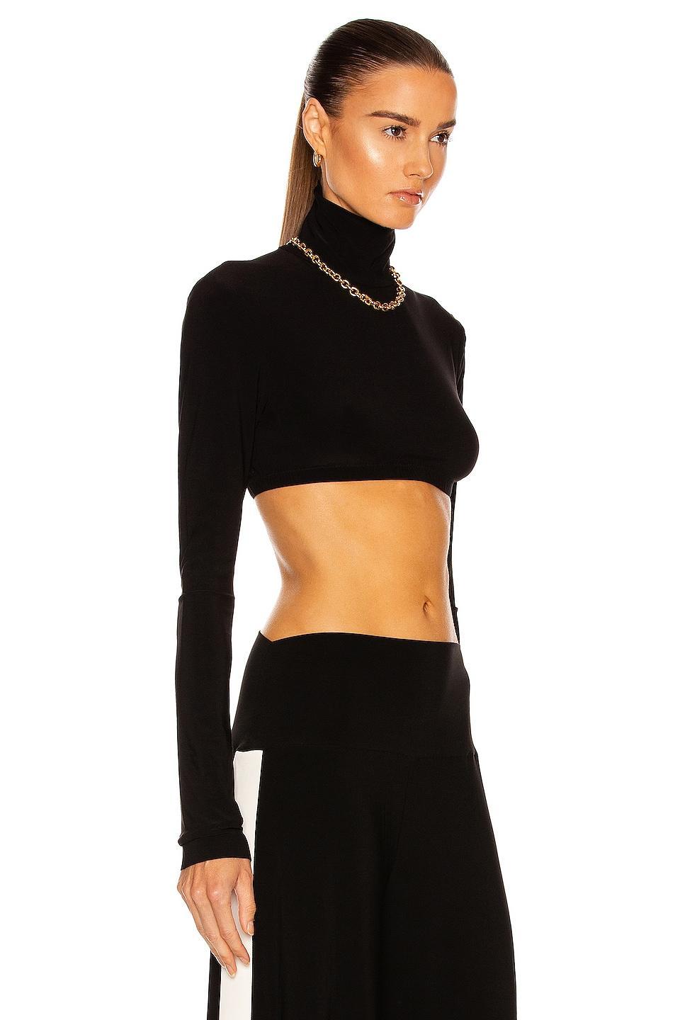 Norma Kamali Cropped Slim Fit Long Sleeve Turtleneck Top Black. (also in L). Product Image