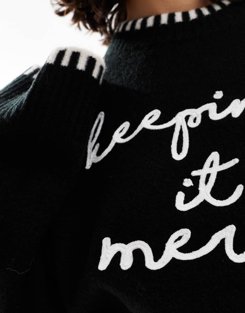 ASOS DESIGN crew neck sweater with blanket stitch and christmas slogan in black and white Product Image