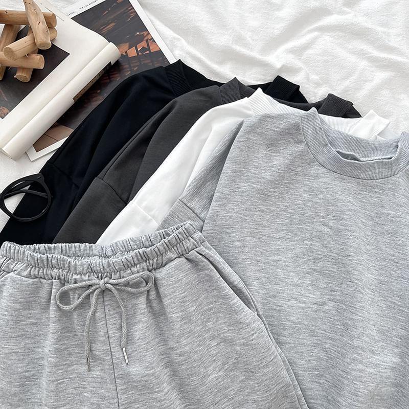 Set: Long-Sleeve Crew Neck Plain Crop T-Shirt + Drawstring Plain Shorts Product Image