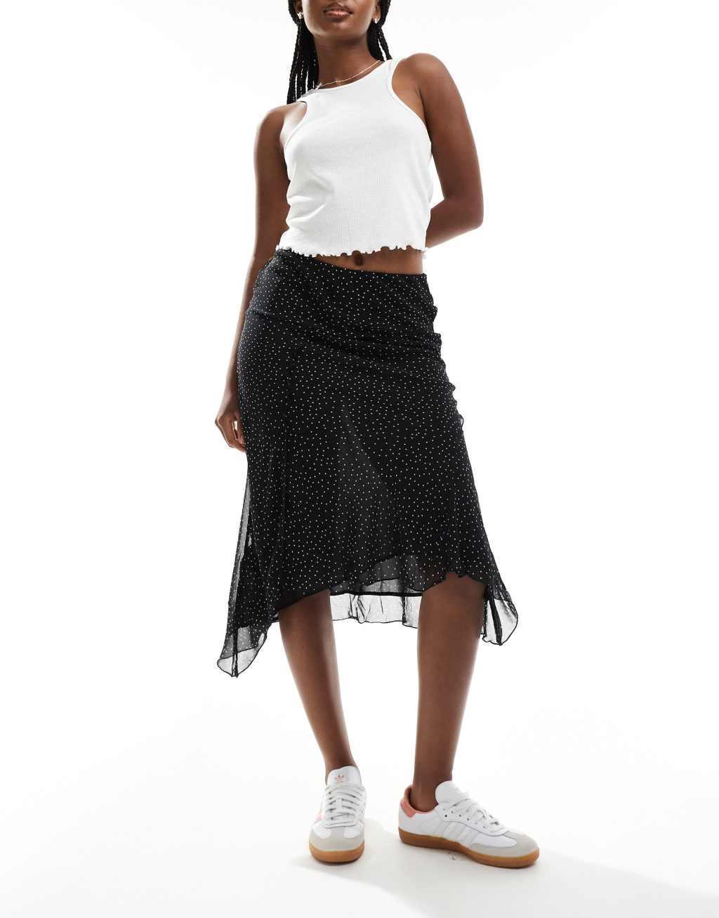 Mango asymmetric hem spot printed midi skirt in black Product Image