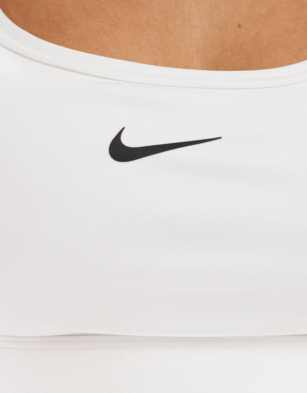 Nike Training Swoosh light support sports bra in white Product Image