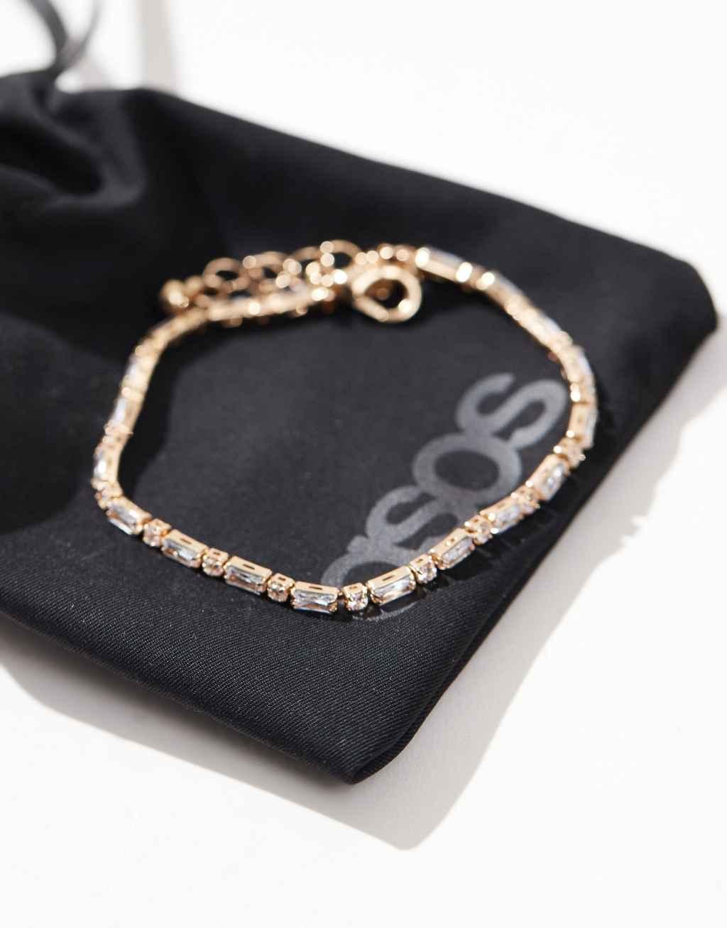 ASOS DESIGN bracelet with cubic zirconia crystals in gold tone with gift bag Product Image