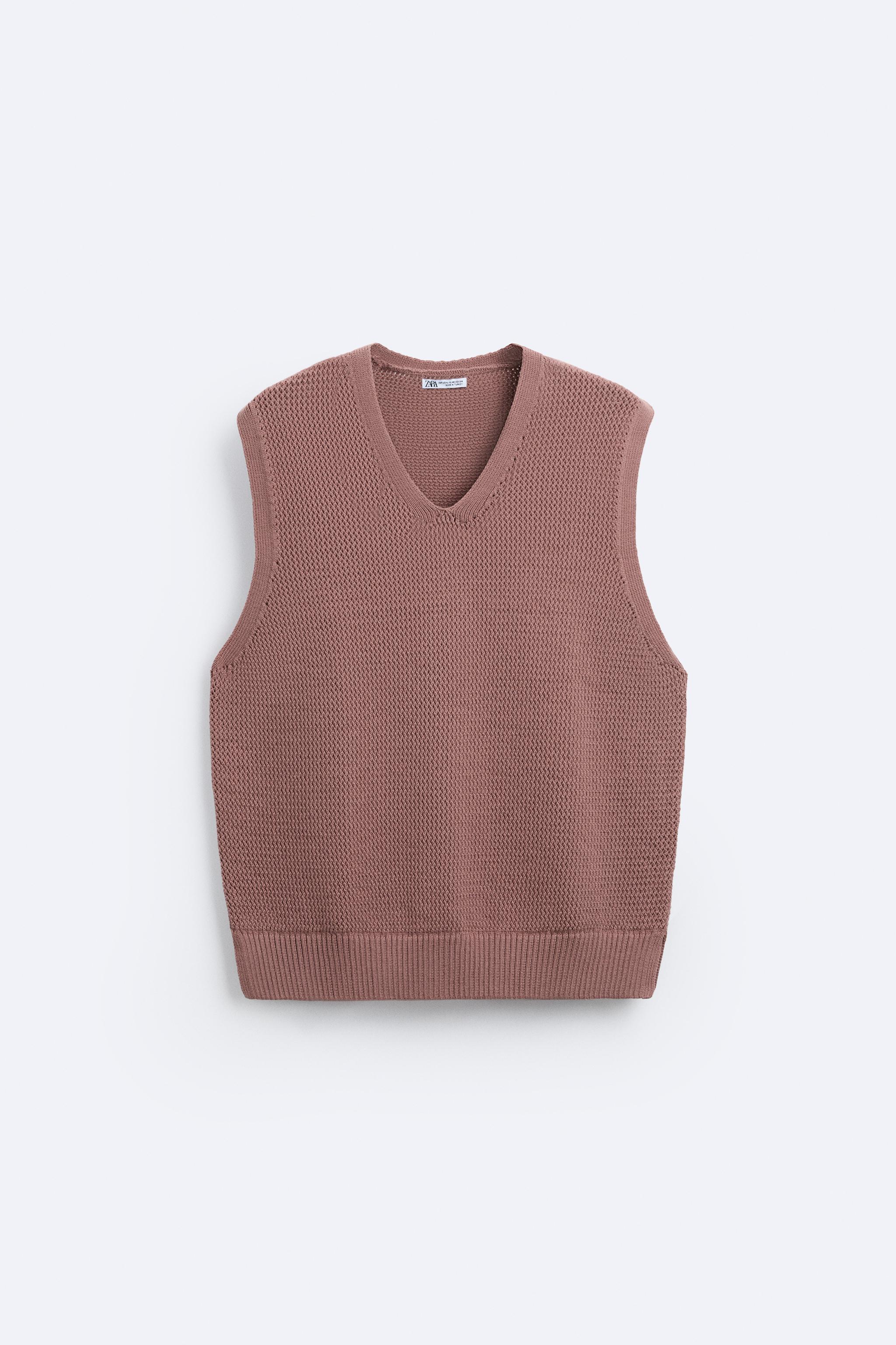 Knit vest in a cotton blend. Sleeveless with V-neckline. Rib trim. Product Image