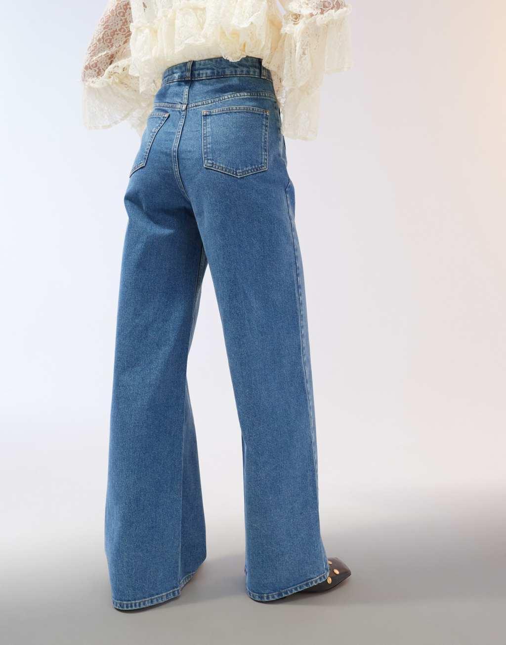 ASOS DESIGN clean wide leg jeans with front pockets in mid blue Product Image