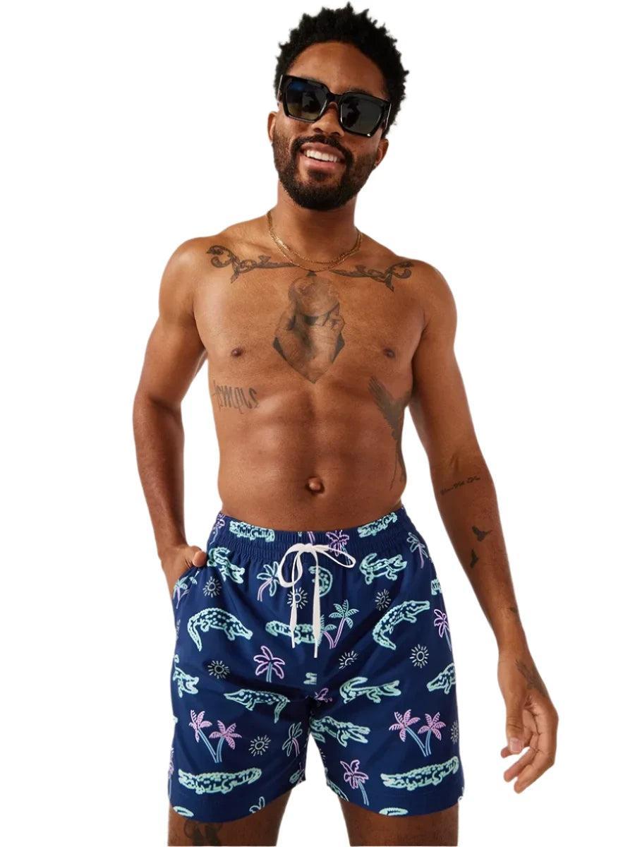 Chubbies The Neon Glades 5.5" Inseam Polyester/Spandex Swim Trunks with Mesh Brief Liner in Navy Blue Product Image